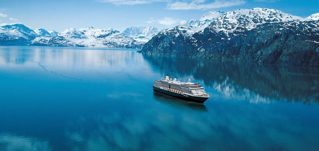 Cruise ship amid snow-capped mountains in Alaska's Glacier Bay