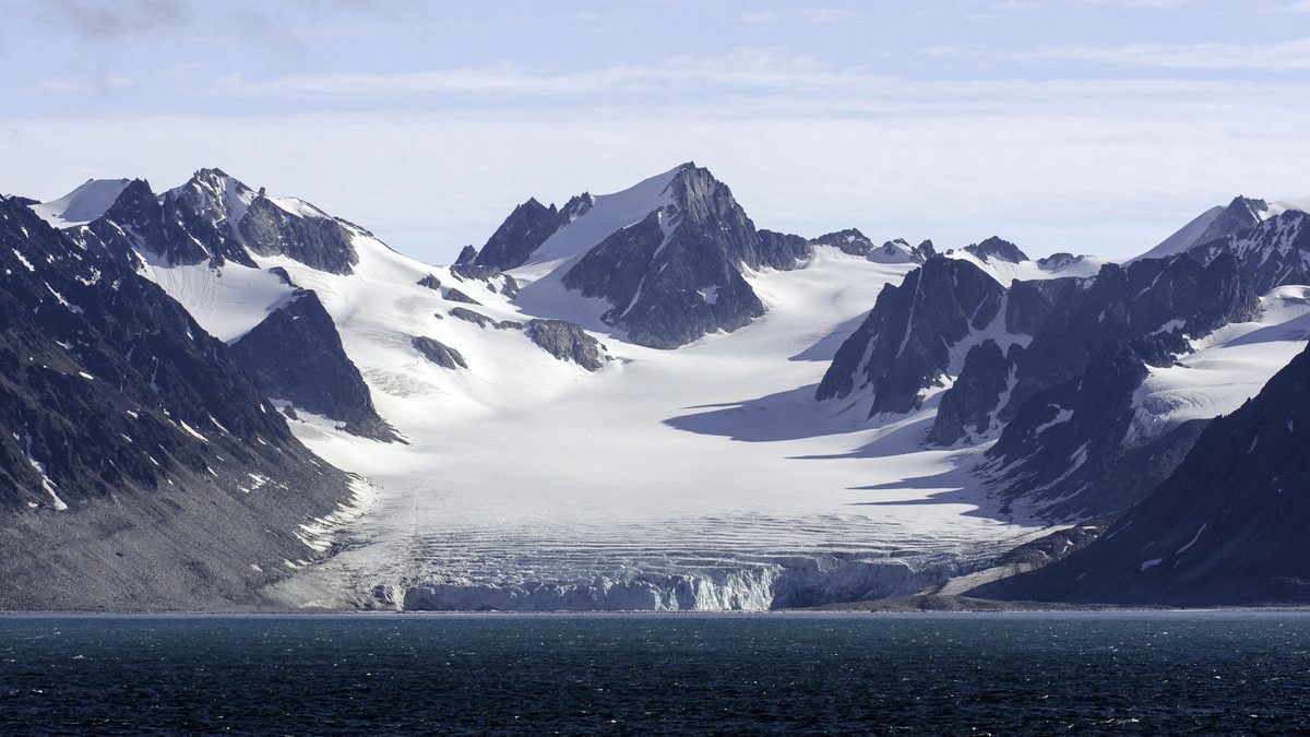 Glacier and jagged peaks in Svalbard, the high Arctic