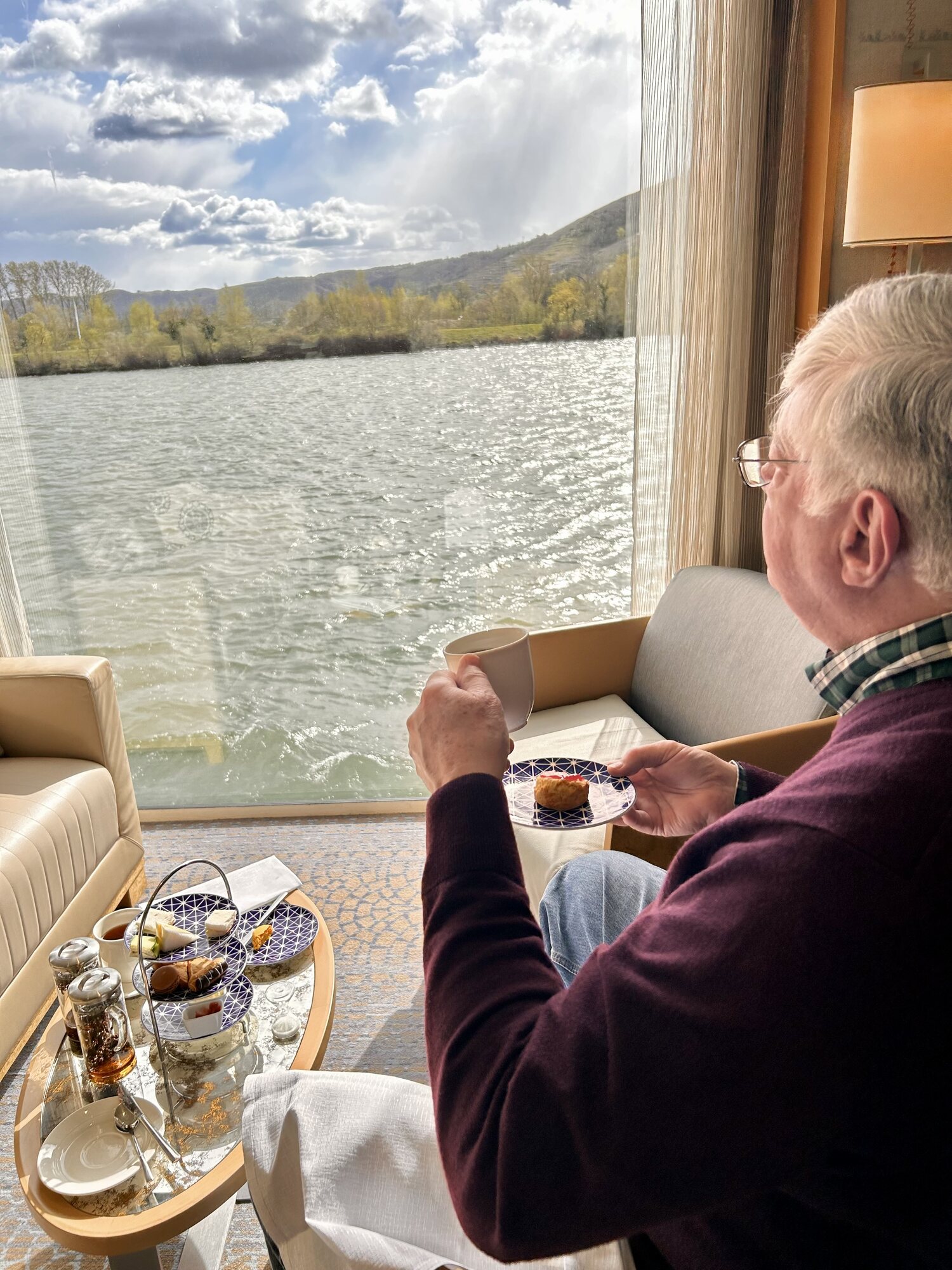 Lewis enjoys afternoon tea and pastries in the stateroom while overlooking the Rhône River from the veranda