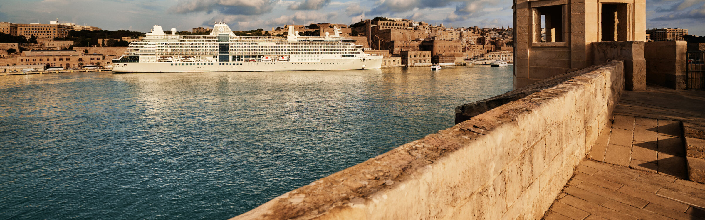 Silversea's Silver Ray in Valletta's Grand Harbour, Malta, at golden hour